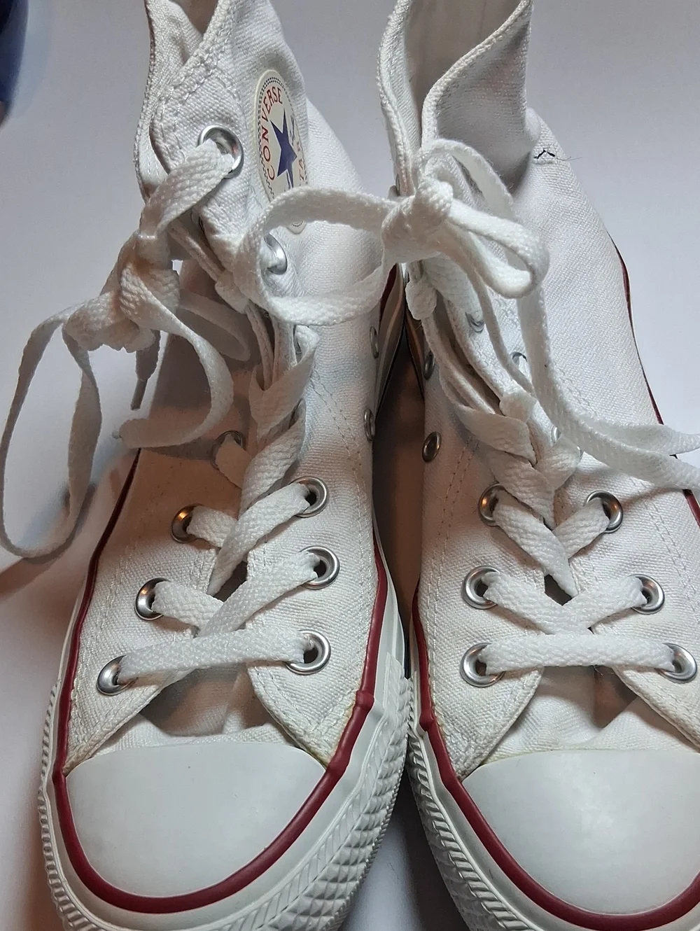 Converse white high-top sneakers with red trim